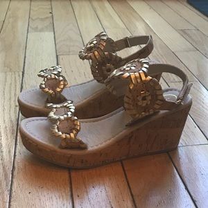 Adorable pair of girl’s wedge sandals.